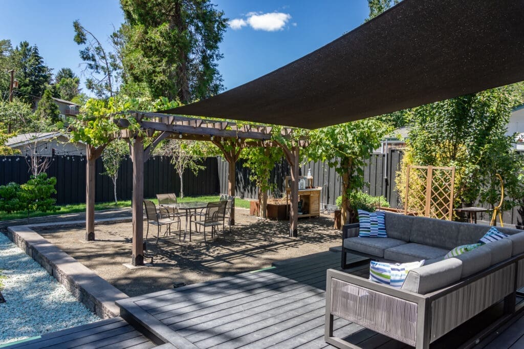 Covered back patio with projection screen and outdoor couch